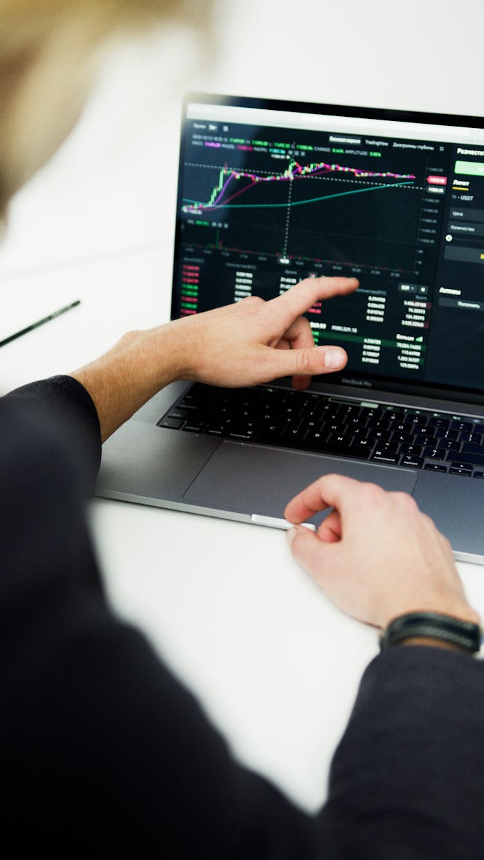 Mastering the First Impression: Your intriguing post title goes here Business professional analyzing stock market trends on a laptop for financial planning.